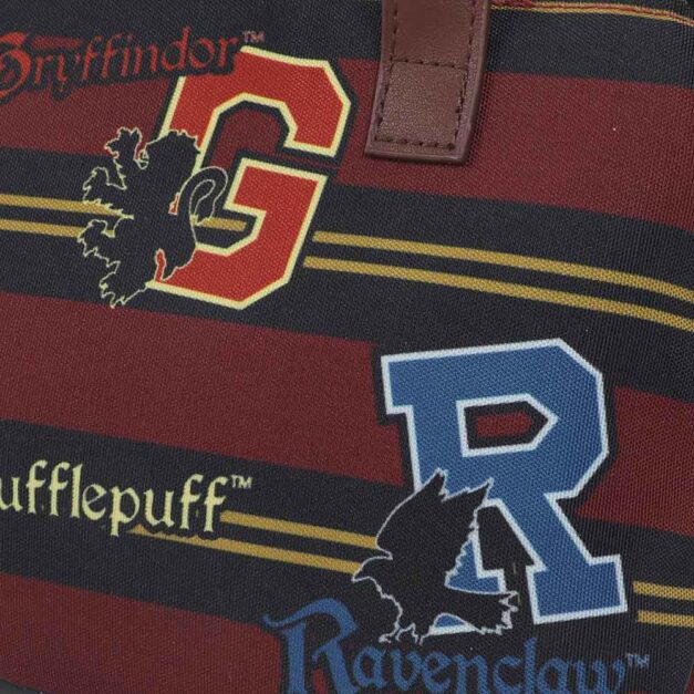 Close-up of Gryffindor and Ravenclaw house icons on Hogwarts Lunch Tote
